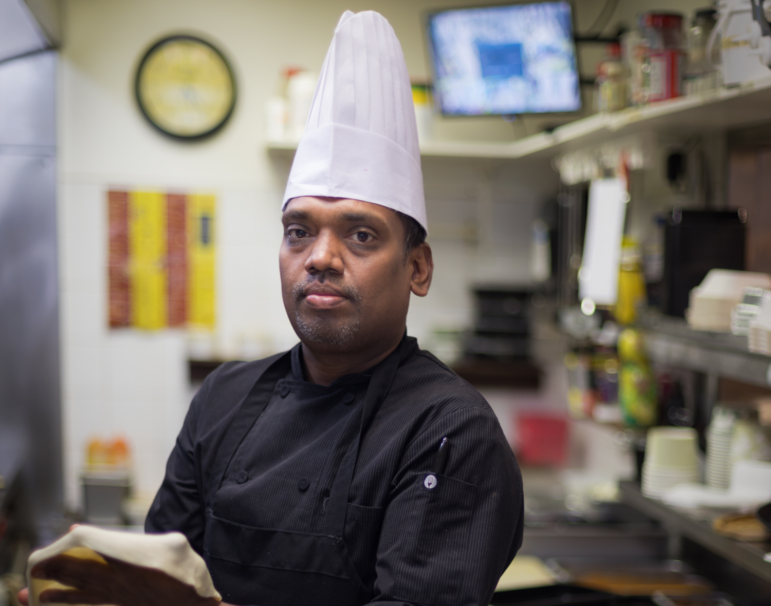 Chef Ravi while cooking Indian Food at Wow India Cornwall